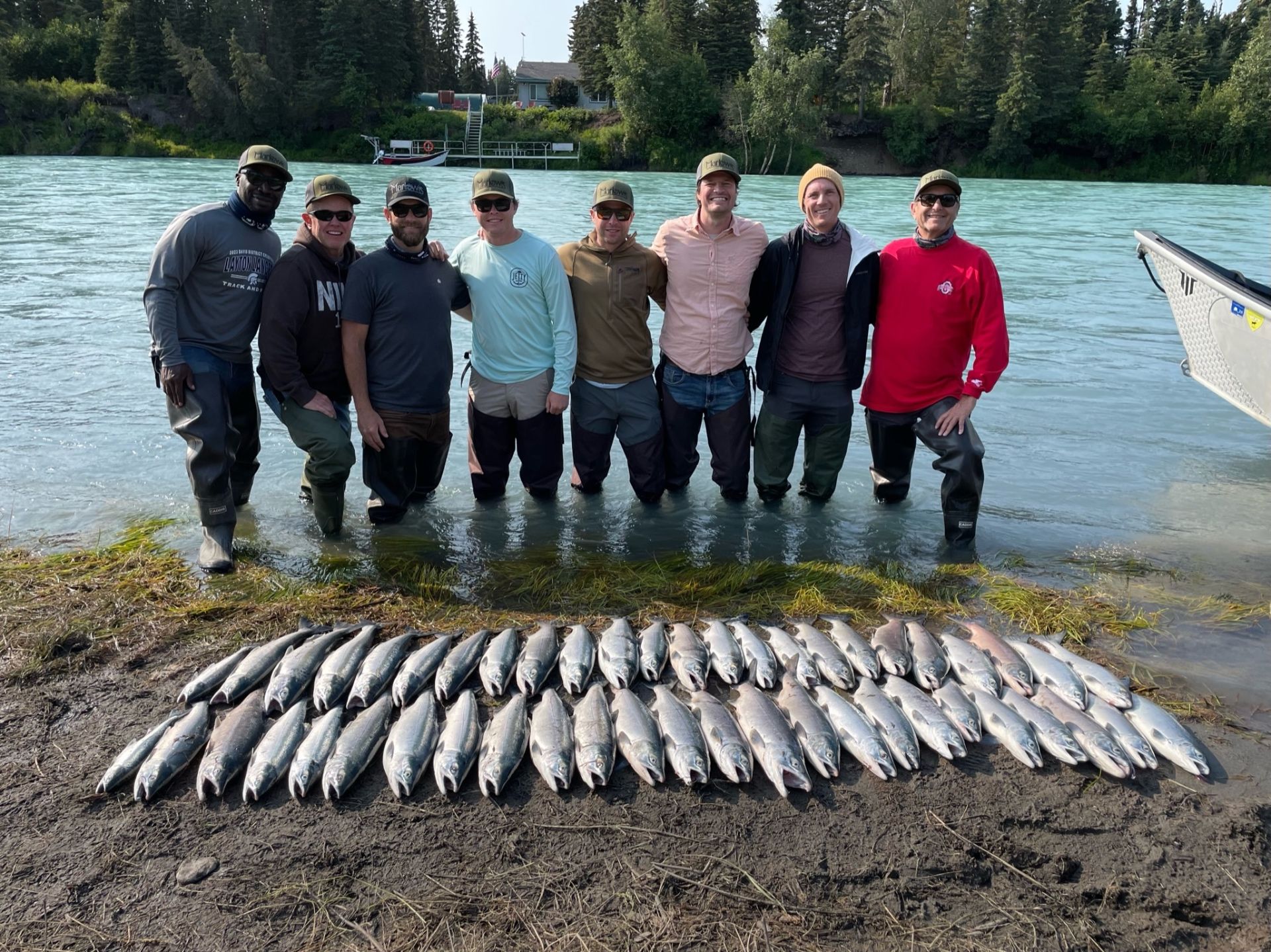 Group of friends with a massive salmon catch on the Kenai River