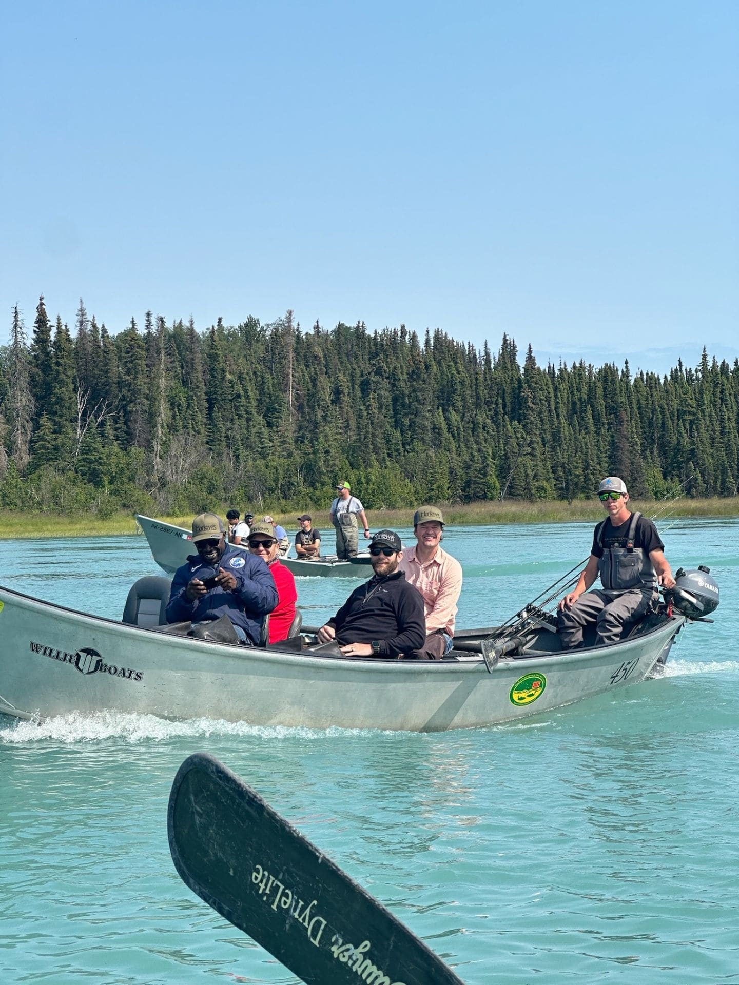 Guests cruising in Willie Boats on turquoise Alaska river